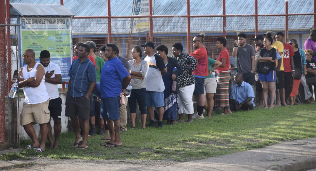Voters line up outside John Wesley Primary School along Grantham Road in Raiwaqa before 7.30am to cast their vote as polling officially opened today for Fiji’s 2022 General Election. Picture: GERALDINE PANAPASA